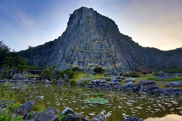 Khao Chee Chan, Buddha Mountain, Chonburi, Pattaya, Thailand a giant Sukhothai-era Buddha sculpture engraved into a cliff face