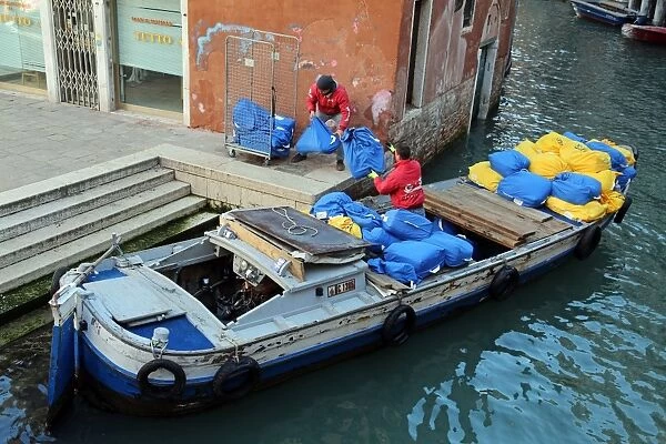 Laundry service boat on a canal in Venice, Italy