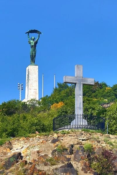 The Liberty Statue and Cross Monument on Gellert Hill in Budapest, Hungary