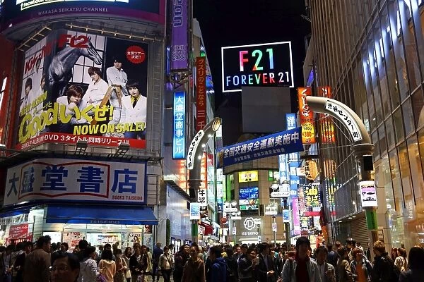 Lights and street and shop signs at night in Shibuya, Tokyo, Japan
