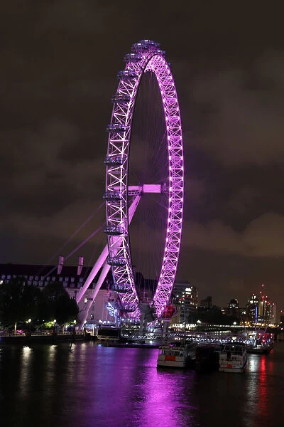 London Eye illuminated pink and the River Thames Framed Photos