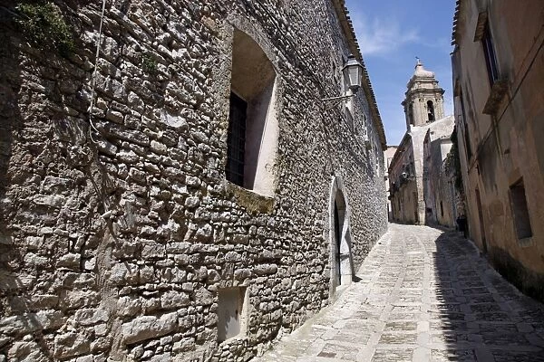 Narrow alley and stone walled street in Erice, Sicily, Italy