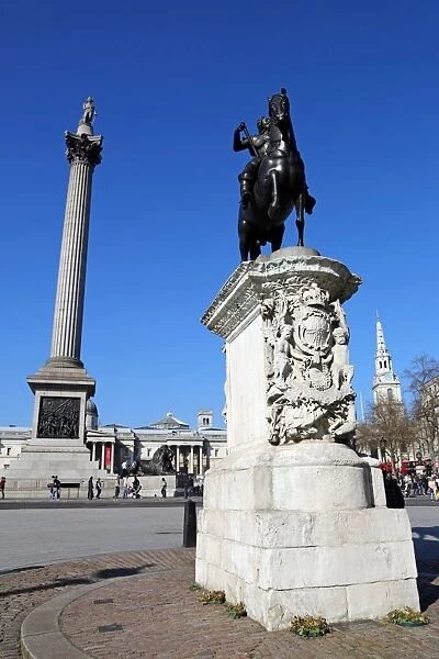 Nelsons Column and statues of King Charles I in Trafalgar Square, London