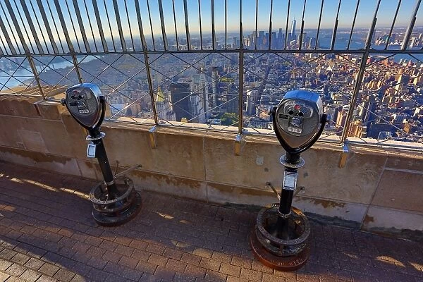 New York Manhattan city skyline and tower viewer telescope binoculars on the Empire State Building observatory viewing deck, New York, America