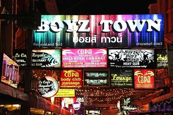 Night scene of illuminated neon signs in Boyz Town in the Red Light District of Pattaya, Thailand
