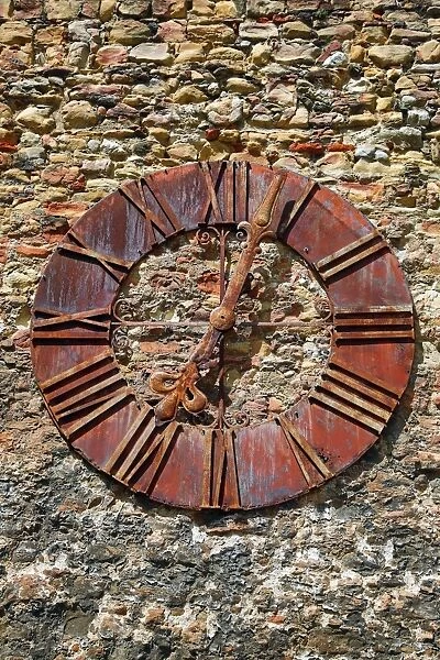 Old rusty clock on the wall beside Zagreb Cathedral in Zagreb, Croatia