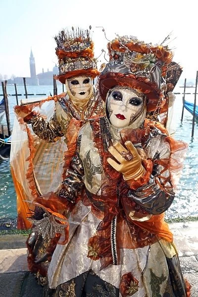 People wearing masks and costumes at the Venice Carnival