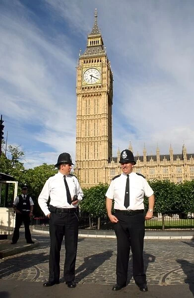 Policemen outside the Houses of Parliament and Big Ben, London