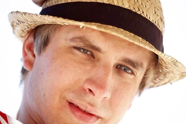 Portrait of a man on summer holiday wearing a straw hat