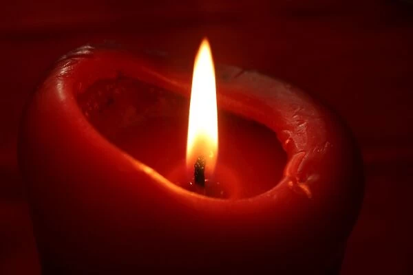 Red candle and flame