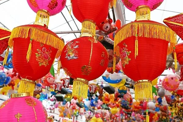 Red Chinese lanterns on sale in a street market in Chinatown in Singapore, Republic of Singapore