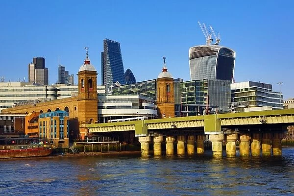 River Thames with Cannon Street railway bridge and the City of London skyline in London, England