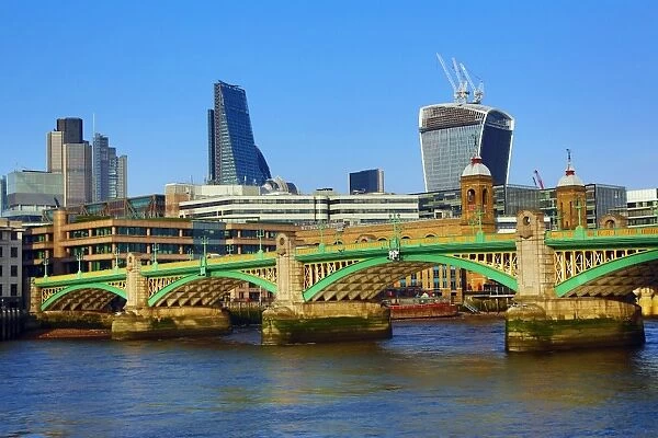 River Thames with Southwark Bridge and the City of London skyline in London, England
