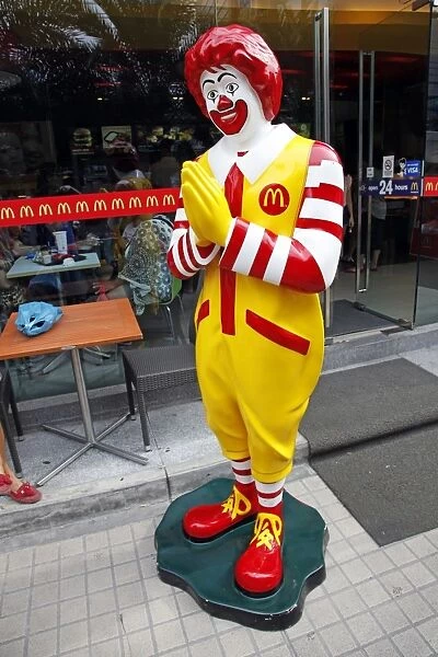 Ronald McDonald statue making Thai greeting Sawasdee in Bangkok, Thailand