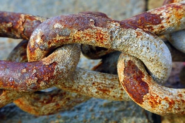 Rusty metal chain links in the harbour in Venice, Italy