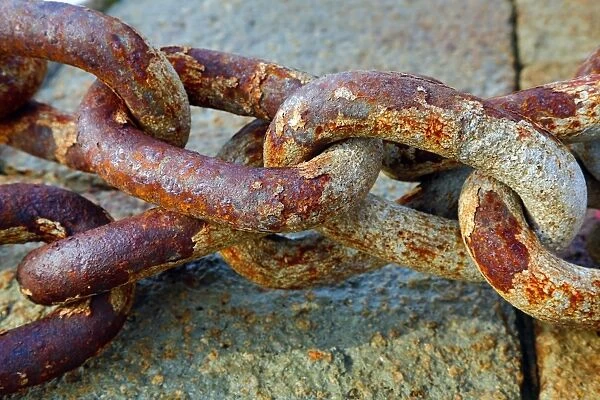 Rusty metal chain links in the harbour in Venice, Italy