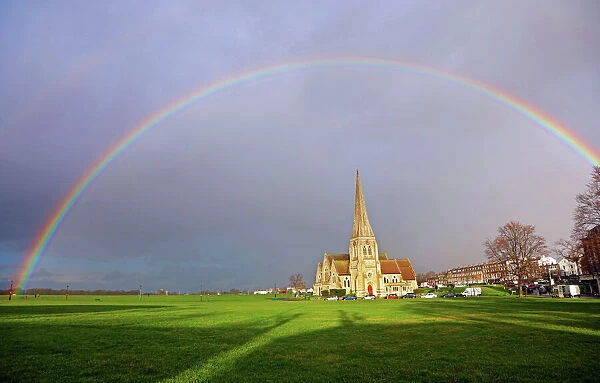 Seasonal weather - Rainbow over All Saints Church, Blackheath, London, UK