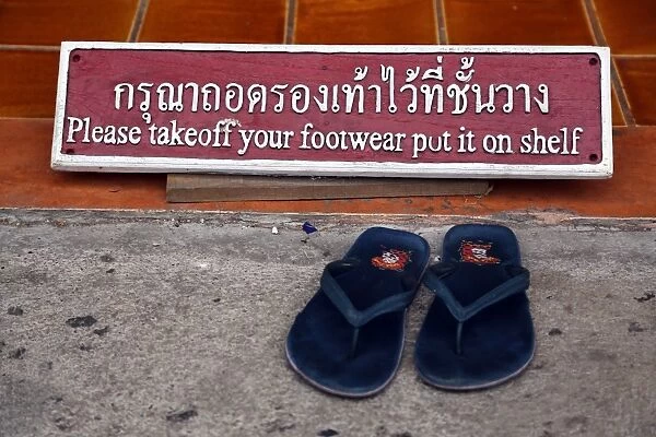 Take of your shoes sign at Wat Chedi Luang temple in Chiang Mai, Thailand