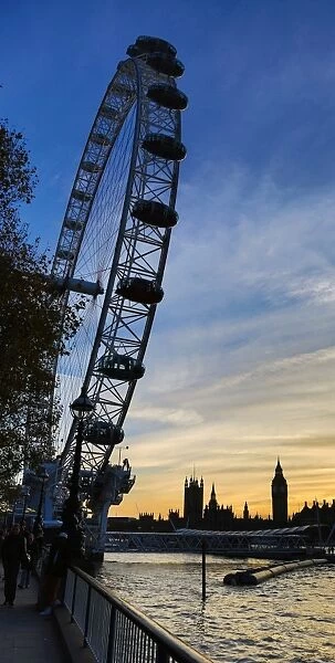Silhouette of Millennium Wheel and Houses of Parliament at Sunset in London