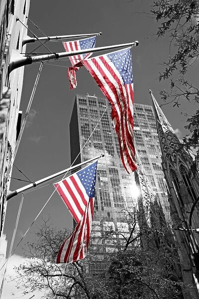 Stars and stripes American flags and St. Patricks Cathedral in New York, USA