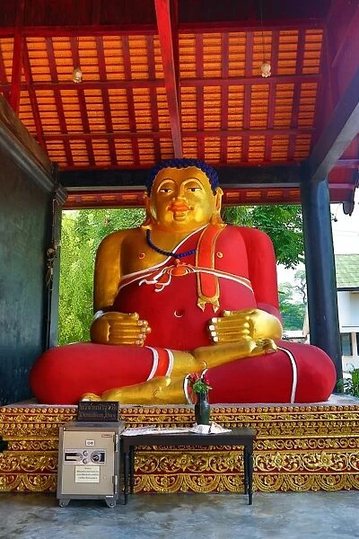 Statue of the fat Monk Tan Pra Maha Kajjana at Wat Chedi Luang Temple in Chiang Mai, Thailand