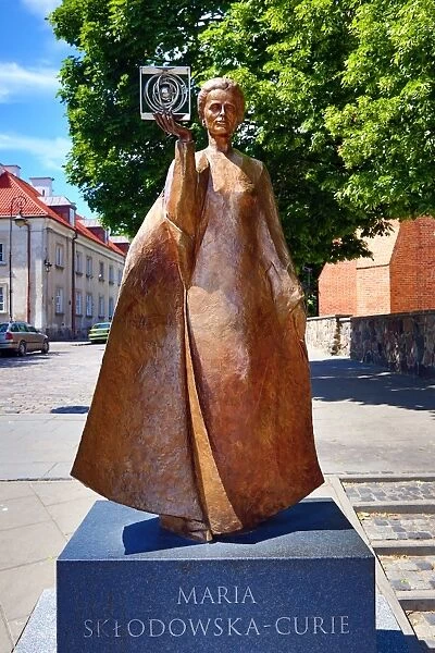 Statue of Marie Sklodowska-Curie holding a model of Polonium in Warsaw, Poland