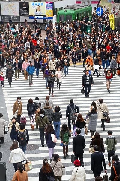 Street scene of people on a zebra crossing in Shibuya, Tokyo, Japan