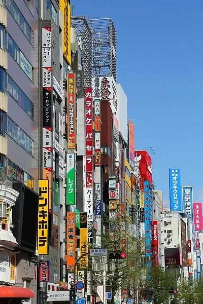 Street scene with signs and advertising in Shinjuku, Tokyo, Japan