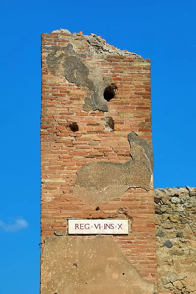 Street sign Rex VI ins X in the ancient Roman city of Pompeii, Italy