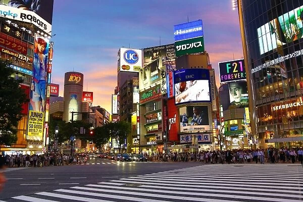 Sunset at the pedestrian crossing at the intersection in Shibuya, Tokyo, Japan