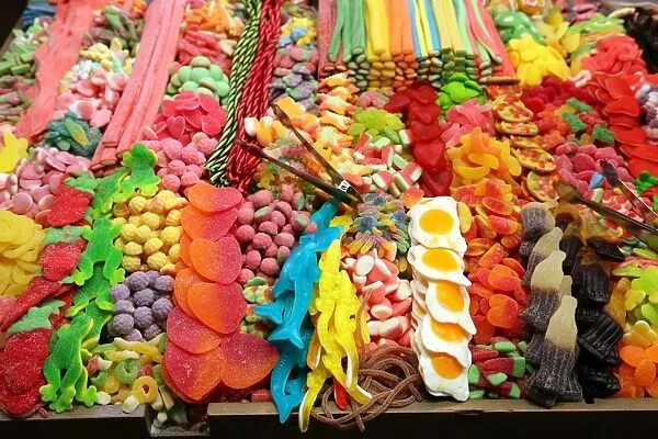 Sweets on a confectionary stall at La Boqueria market de St Josep, Barcelona, Spain