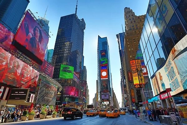 Tall buildings and traffic in Times Square, New York. America
