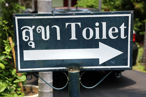Toilet sign in Thai at Wat Phra Singh Temple in Chiang Mai, Thailand