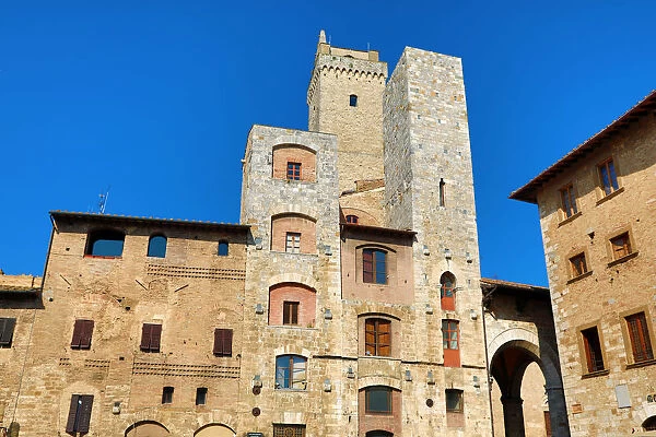 The Torre Grossa and buildings in the Piazza Cisterno in San Gimignano, Tuscany, Italy