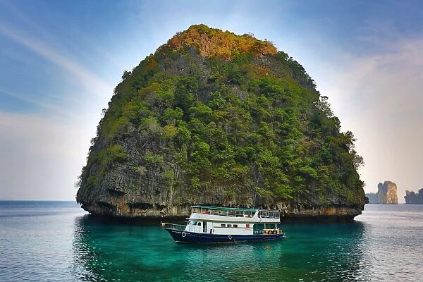 Tour boat and island on Ko Phi Phi Le island, Andaman Sea, Thailand