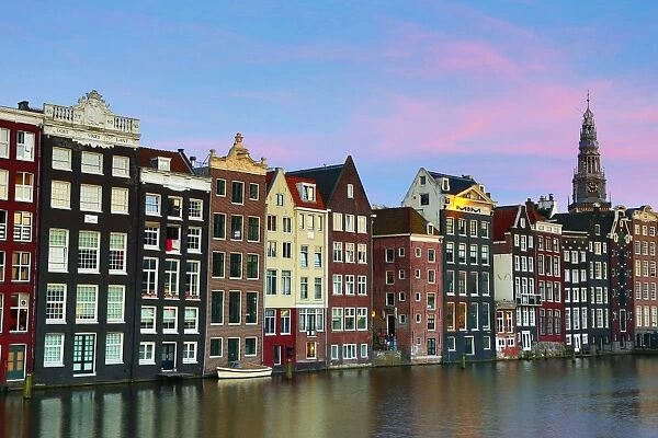 Traditional houses on the Damrak canal in Amsterdam, Holland