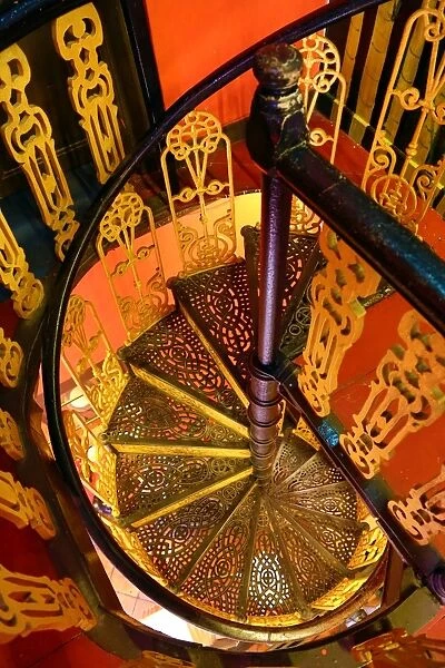 Traditional ironwork spiral staircase in a restaurant in Malacca, Malaysia