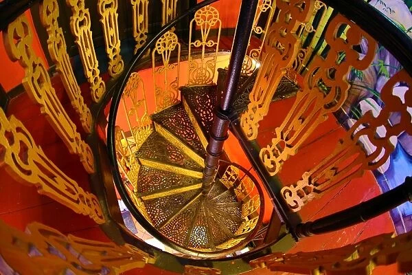 Traditional ironwork spiral staircase in a restaurant in Malacca, Malaysia
