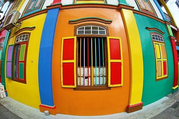 Traditional rainbow coloured house with colourful windows and shutters in Little India in Singapore, Republic of Singapore