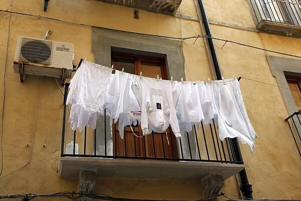 Washing hanging out in the street in Trapani, Sicily, Italy