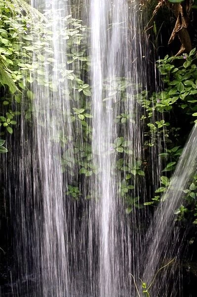 Waterfall. Rushing water falling from waterfall