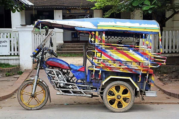Three wheeled Tuk Tuk taxi in Luang Prabang, Laos