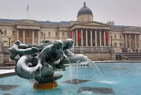 Winter snow, ice and frozen fountains, Trafalgar Square, London