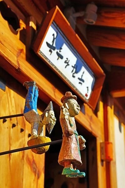 Wooden figures on a traditional building in the old town of Bukchon Hanok village in Seoul