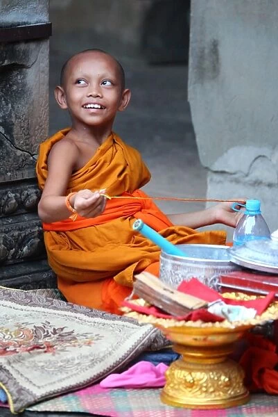 Young Buddhist monk at Angkor Wat Temple in Siem Reap, Cambodia
