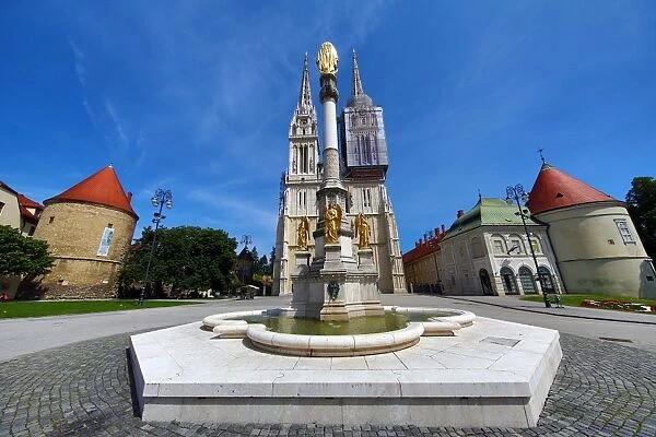 Zagreb Cathedral with tower renovation and Holy Mary Monument column in Zagreb, Croatia