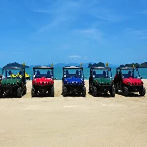 4X4 jeeps on a tropical sandy beach, Langkawi, Malaysia