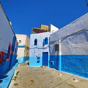 Blue and white walls of buildings in the Kasbah of the Udayas in Rabat, Morocco