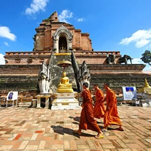 Buddhist Monks at Chedi at Wat Chedi Luang Temple in Chiang Mai, Thailand