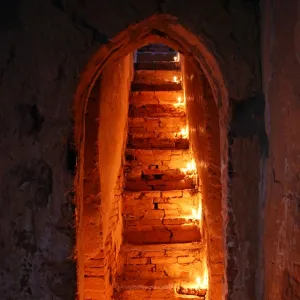 Candles on stairs at North Guni Temple Pagoda on the Plain of Bagan, Bagan, Myanmar